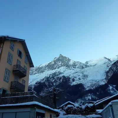 a building with a view of a mountain at Appartement Chamonix Bossons in Chamonix-Mont-Blanc