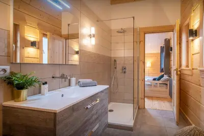 a bathroom with a sink and a shower at Chalet Choquette - OVO Network in Les Houches