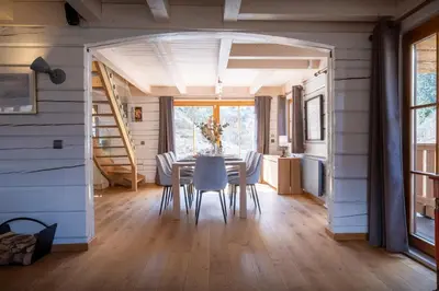 a dining room with a table and chairs at Chalet Choquette - OVO Network in Les Houches