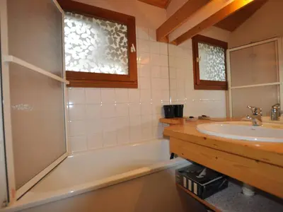 a bathroom with a tub and a sink and a shower at Chamonix: Charmant 2 pièces avec parking proche centre - FR-1-517-66 in Chamonix-Mont-Blanc