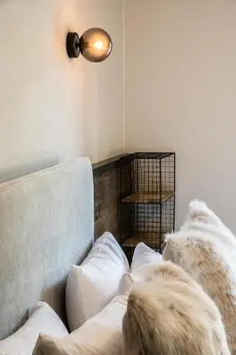 a dog sitting on a couch in a living room at Kotibé Chamonix - BY EMERALD STAY in Chamonix-Mont-Blanc