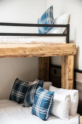 two bunk beds in a room with pillows at Kotibé Chamonix - BY EMERALD STAY in Chamonix-Mont-Blanc