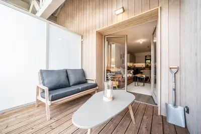 a living room with a couch and a table at Kotibé Chamonix - BY EMERALD STAY in Chamonix-Mont-Blanc