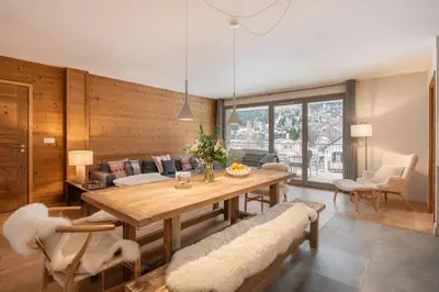a bedroom with a bed with a wooden wall at Kabano Chamonix - BY EMERALD STAY in Chamonix-Mont-Blanc