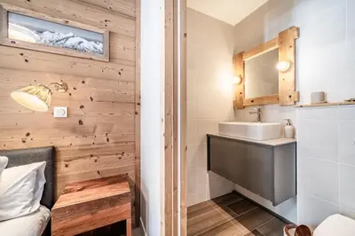 a bathroom with a sink and a mirror at Kabano Chamonix - BY EMERALD STAY in Chamonix-Mont-Blanc