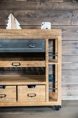 a wooden console table with a tv on top at Kalmia Chamonix - BY EMERALD STAY in Chamonix-Mont-Blanc