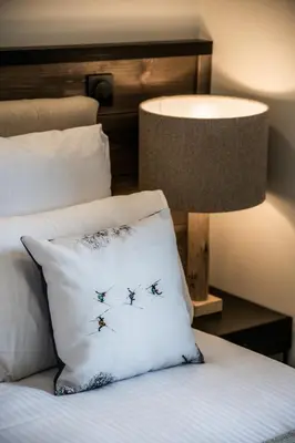 a bedroom with a bed with a pillow and a lamp at Kalmia Chamonix - BY EMERALD STAY in Chamonix-Mont-Blanc