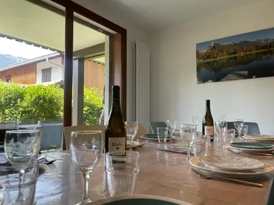 a table with wine bottles and glasses on it at Appartement familial à Samoëns, animaux admis, Wi-Fi inclus - FR-1-624-133 in Samoëns