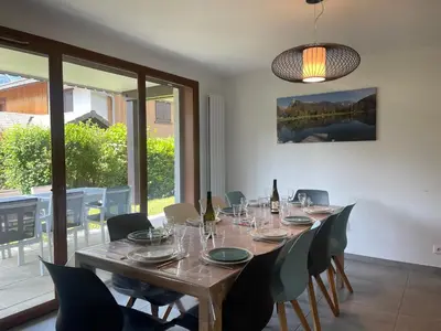 a dining room with a long table and chairs at Appartement familial à Samoëns, animaux admis, Wi-Fi inclus - FR-1-624-133 in Samoëns