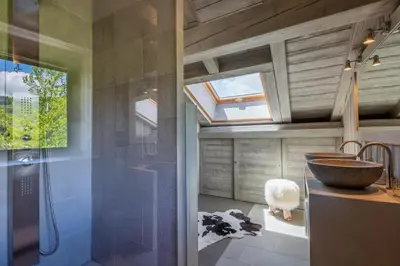 a bathroom with a sink and a shower at Chalet Mozart I Le Chalet Club in Megève