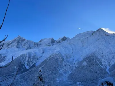 a mountain range with snow on the top of it at Datcha of Sky -Jardin - Calme - 180 vues - 9 chambres & Studio Appt in Les Houches