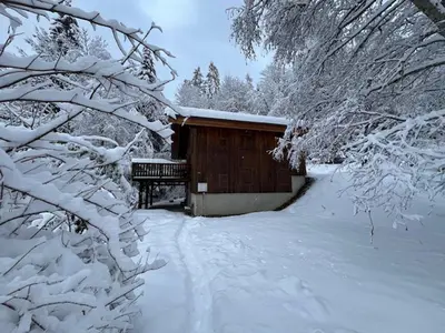 a cabin in the snow with snow covered trees at Datcha of Sky -Jardin - Calme - 180 vues - 9 chambres & Studio Appt in Les Houches