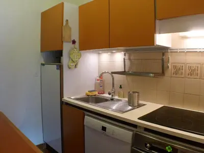 a kitchen with a sink and a refrigerator at 2 pièces confortable & lumineux au centre de Samoëns - Animaux admis et parking inclus - FR-1-629-126 in Samoëns