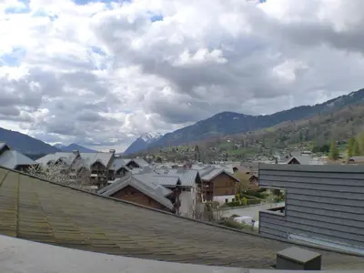 a view of a town from the roof of a house at 2 pièces confortable & lumineux au centre de Samoëns - Animaux admis et parking inclus - FR-1-629-126 in Samoëns