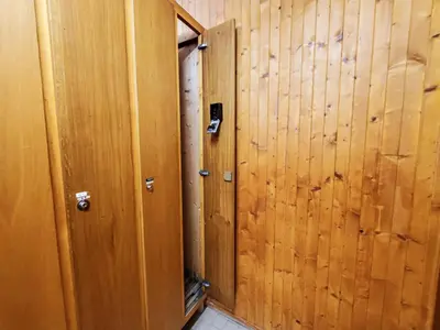 an empty room with wooden walls and a door at Les Aiguilles du Brevent - Grand Appt Renove - Central - Terrasse avec Vue in Chamonix-Mont-Blanc