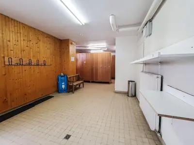 an empty room with a room with wooden walls at Les Aiguilles du Brevent - Grand Appt Renove - Central - Terrasse avec Vue in Chamonix-Mont-Blanc