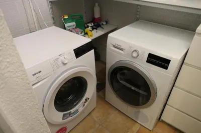 a washing machine and a washer in a kitchen at Les Chalet Du Soleil - Chalets du Soleil 9 MAE-6344 in Saint-Gervais-les-Bains