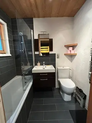 a bathroom with a toilet and a sink and a shower at Studio équipé / centre station in Les Carroz d'Araches