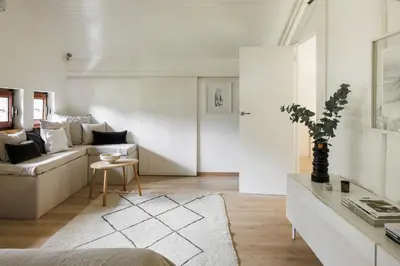 a living room with a couch and a table at Chalet Hautbois - Family Chalet with 5 Bedrooms with Glacial views CHAMONIX - By Cozee Rentals in Chamonix-Mont-Blanc
