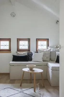 a living room with a couch and a table at Chalet Hautbois - Family Chalet with 5 Bedrooms with Glacial views CHAMONIX - By Cozee Rentals in Chamonix-Mont-Blanc