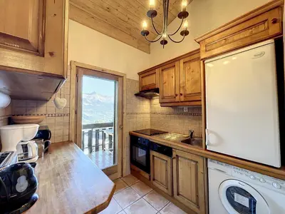 a kitchen with a sink and a dishwasher at Superbe 3 Pièces avec Balcons en Plein Cœur de Combloux - Parking, Wifi, Lave-linge - FR-1-560-106 in Combloux