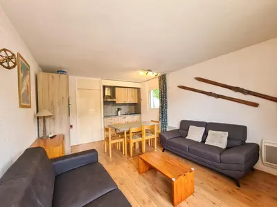 a living room with a couch and a table at Appartement Flaine Forêt in Flaine