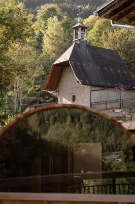 a view of a church from a car window at Chalet Nant Rouge in Les Contamines-Montjoie