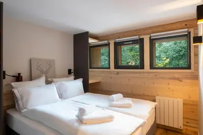 a bedroom with a bed with two towels on it at Chalet Nant Rouge in Les Contamines-Montjoie
