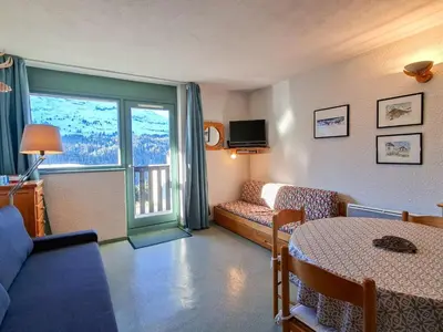 a living room with a couch and a table at Studio Confortable au Centre de Flaine avec Balcon - FR-1-425-200 in Arâches-la-Frasse