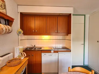 a bedroom with two bunk beds and a living room at Studio Confortable au Centre de Flaine avec Balcon - FR-1-425-200 in Arâches-la-Frasse