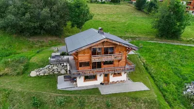 an overhead view of a large wooden house at Chalet vue Mont Blanc avec jacuzzi extérieur in Combloux