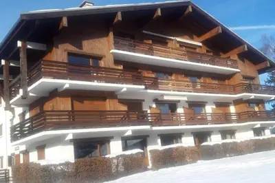 a building with balconies on the side of it at Mon refuge face au Mont Blanc in Saint-Gervais-les-Bains