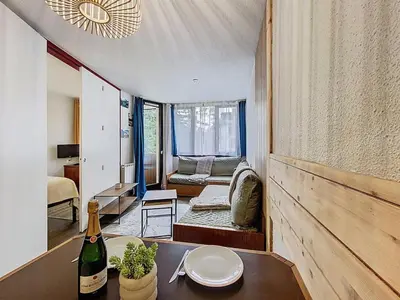 a balcony with a table with bowls on it at Coeur de Chamonix, Appartement, parking in Chamonix-Mont-Blanc