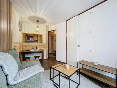 a bathroom with a white tub and a sink at Coeur de Chamonix, Appartement, parking in Chamonix-Mont-Blanc