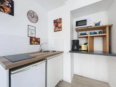 a kitchen with a sink and a counter top at STUDIO LIMBO CHAMONIX HYPER CENTRE Vue imprenable sur le Mont-blanc in Chamonix-Mont-Blanc