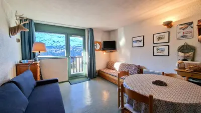 a living room with a couch and a table at Résidence Gemeaux - Studio confortable · Centre station · Balcon MAE-7844 in Magland