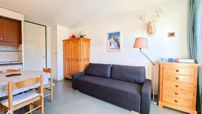 a living room with a couch and a table at Résidence Gemeaux - Studio confortable · Centre station · Balcon MAE-7844 in Magland