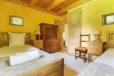 a bedroom with two beds and a desk and a chair at Chalet de charme - 8 pers - 140m2 - Jardin - Calme in Les Houches