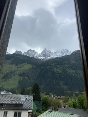 a view of the mountains from a window at Abeille de Chamonix in Chamonix-Mont-Blanc