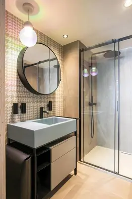 a bathroom with a sink and a shower at Rochebrune - Appartement de luxe in Megève