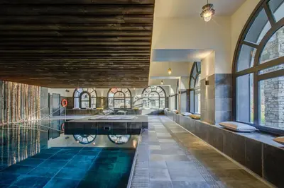 a bathroom with a pool in the middle of a building at Apartment Chéserys, Alpes Travel, Les Praz Sleeps 2-4 in Chamonix-Mont-Blanc