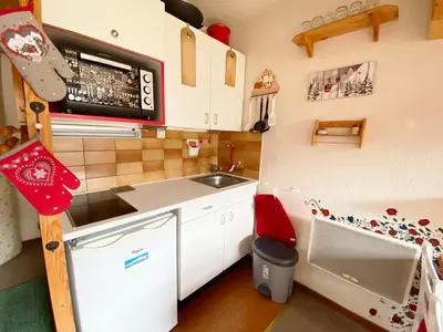 a small kitchen and dining room with a table at Appartement 2 pièces mezzanine au pied des pistes - 5 personnes - FR-1-815-91 in Morillon