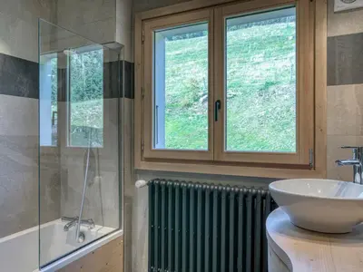 a bathroom with a sink and a glass window at Confortable 3 pièces à Megève avec Wi-Fi et garage à skis - FR-1-453-306 in Megève
