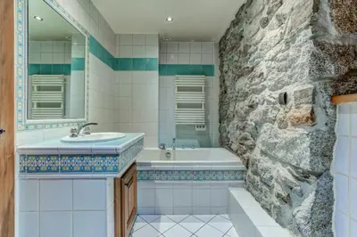 a bathroom with a sink and a bath tub at Spacious 3-bed in the heart of Chamonix with sauna in Chamonix-Mont-Blanc