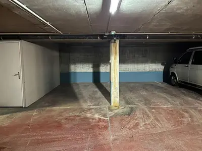 a parking garage with a car parked in it at Spacious 3-bed in the heart of Chamonix with sauna in Chamonix-Mont-Blanc