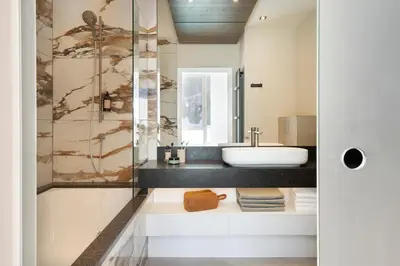 a bathroom with a sink and a shower at MGM Hôtels & Résidences - Résidence Alhéna in Flaine