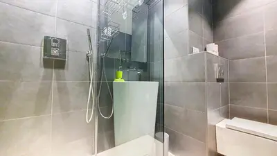 a bathroom with a shower with a glass door at Aiguille Rouge in Chamonix-Mont-Blanc