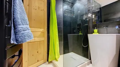 a bathroom with a shower with a toilet and a sink at Aiguille Rouge in Chamonix-Mont-Blanc