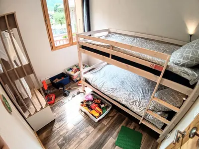an overhead view of a bedroom with bunk beds at Chez Léon Jacuzzi et sauna in Samoëns