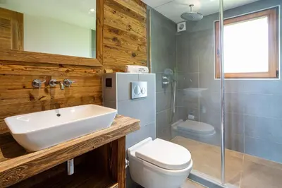 a bathroom with a sink and a toilet and a shower at Chalet du Dard - Chamonix All Year in Chamonix-Mont-Blanc